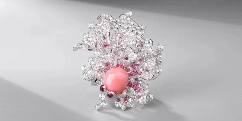 Diamond brooch with pink opal center stone